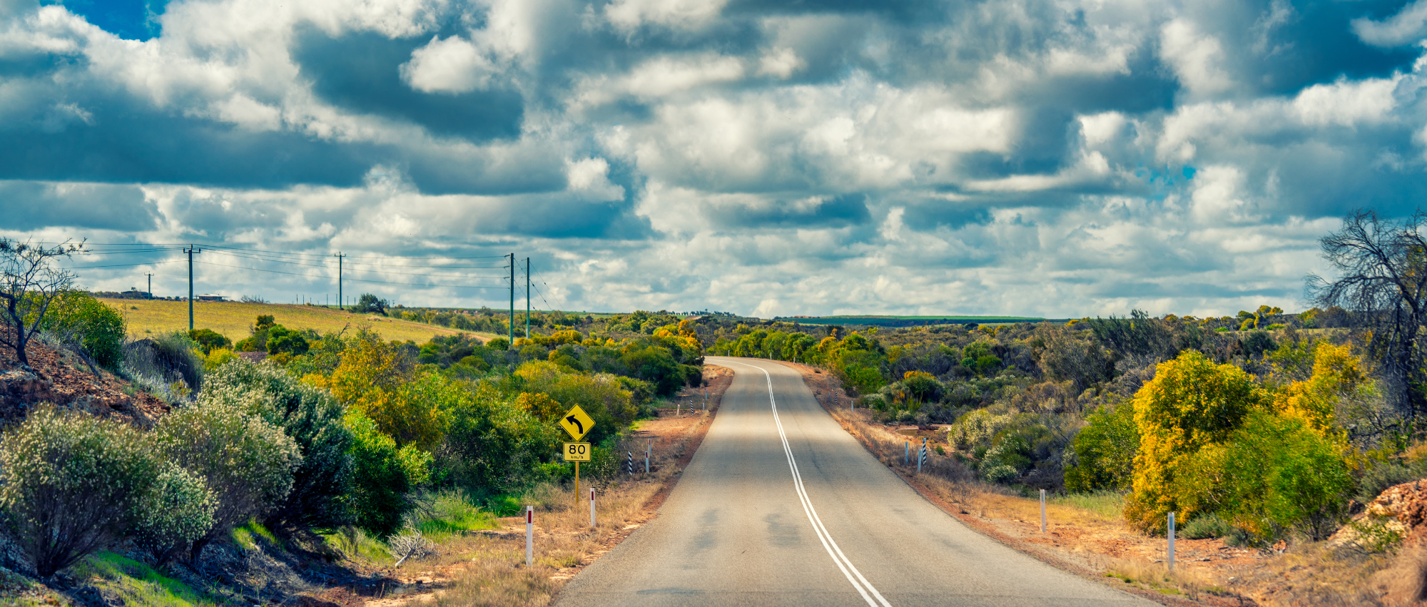 An open country road running to the horizon